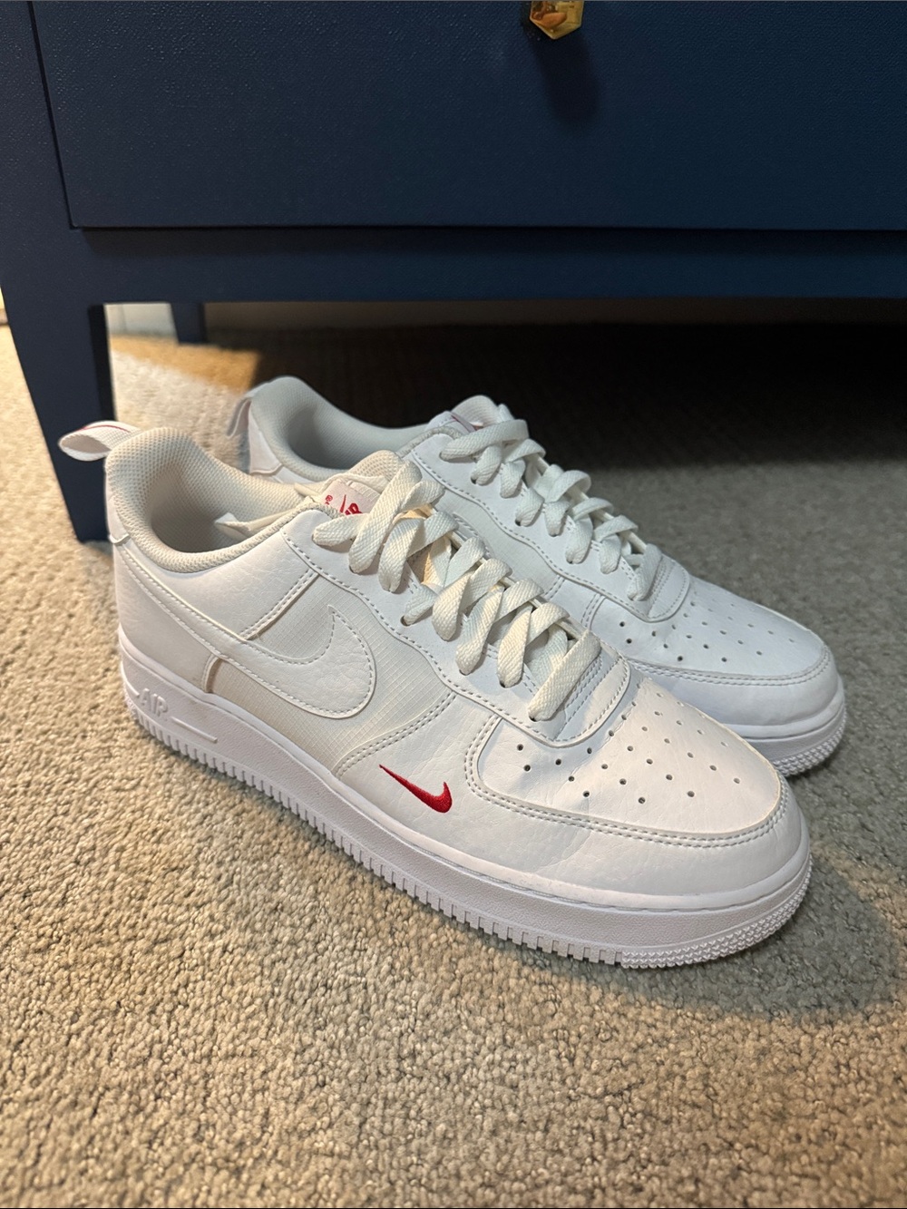 Nike White Low-Top Sneakers with Small Red Swoosh